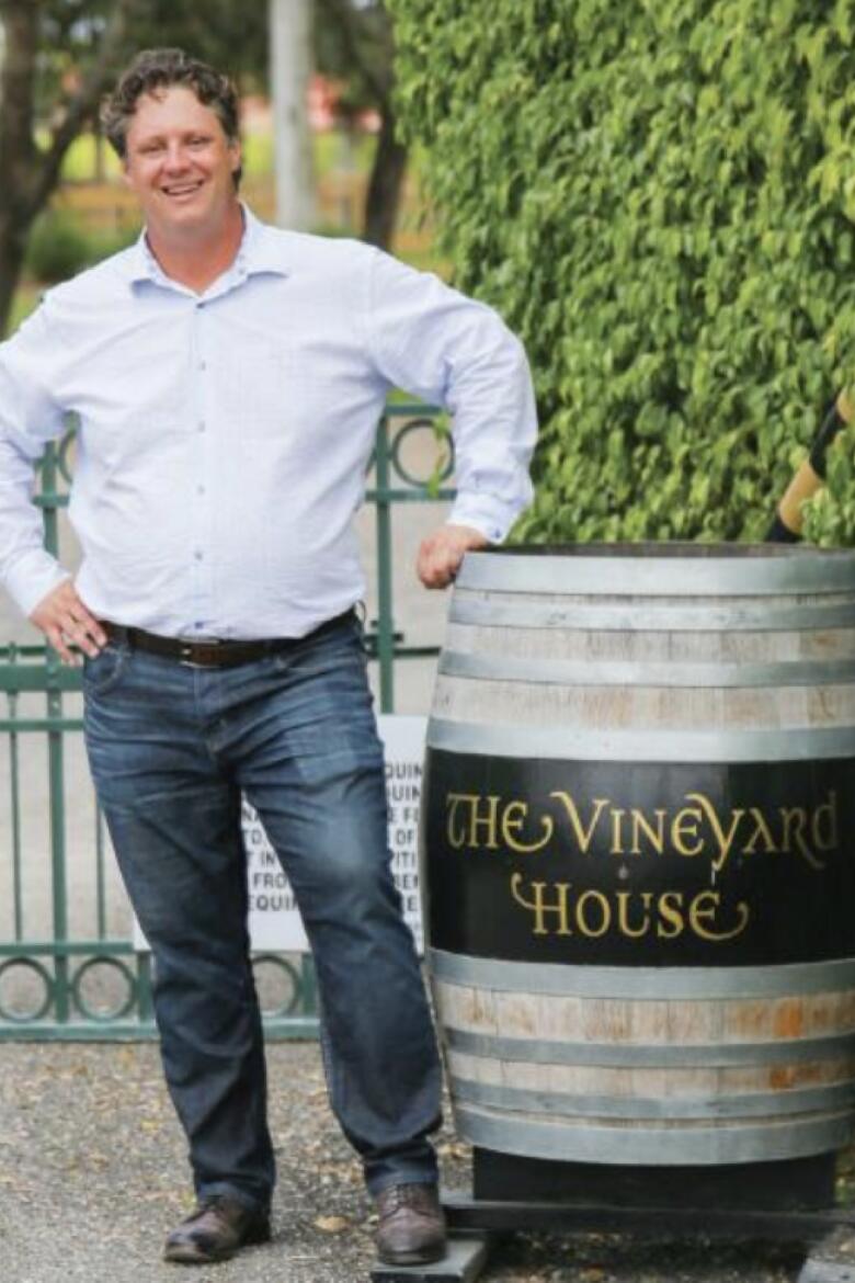 Jeremy Nickel next to The Vineyard House barrel