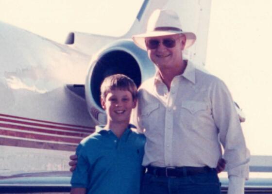 Jeremy and Gil Nickel standing next to jet