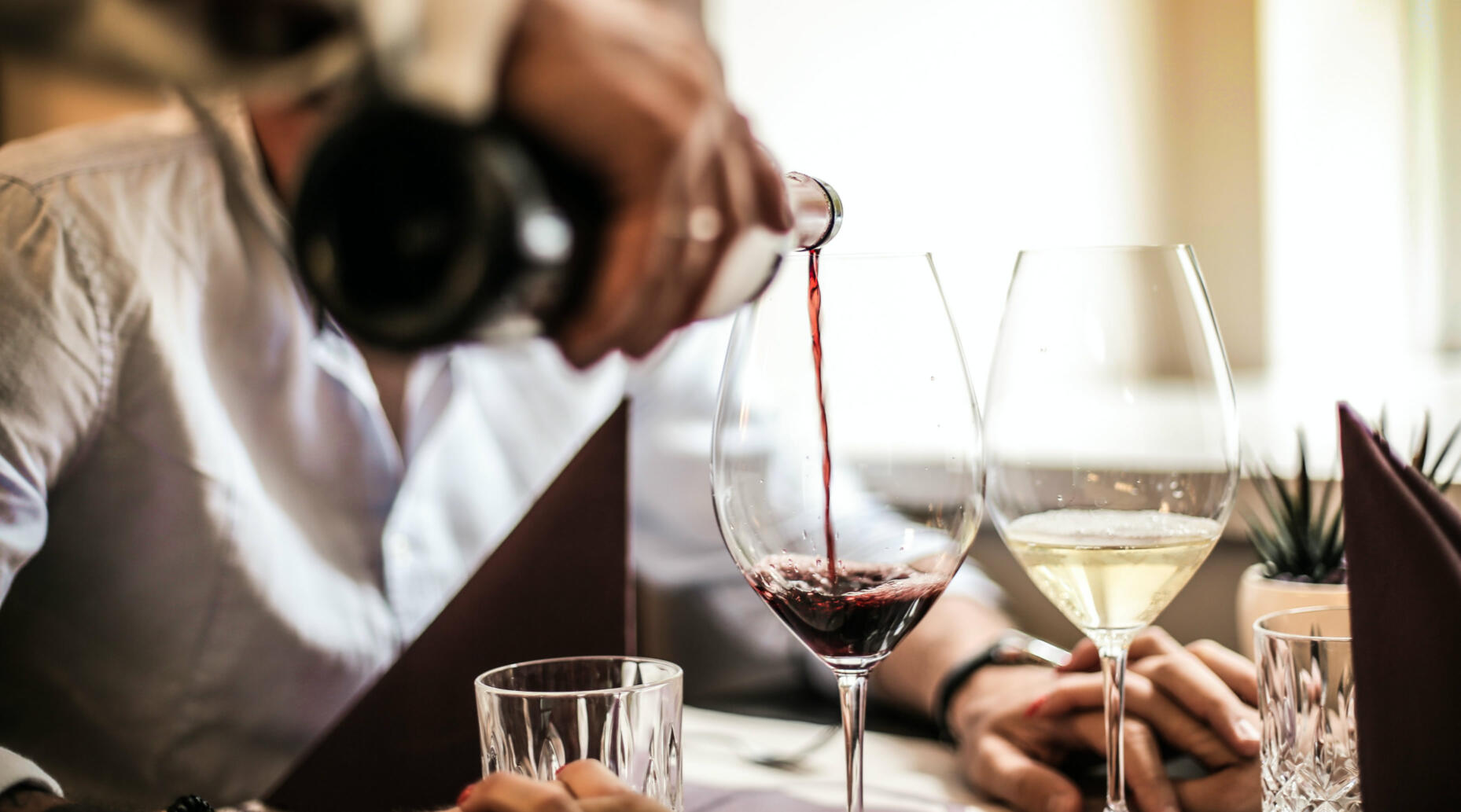 Wine glasses being filled